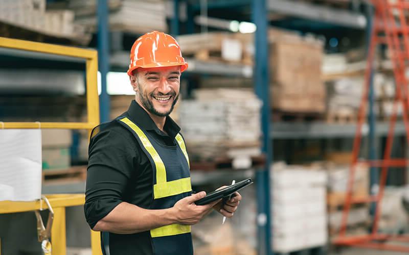 Man in hard hat working in a warehouse